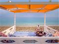Hotel Kokkari Beach: fotografie vybavení exteriérů a interiérů ubytování.